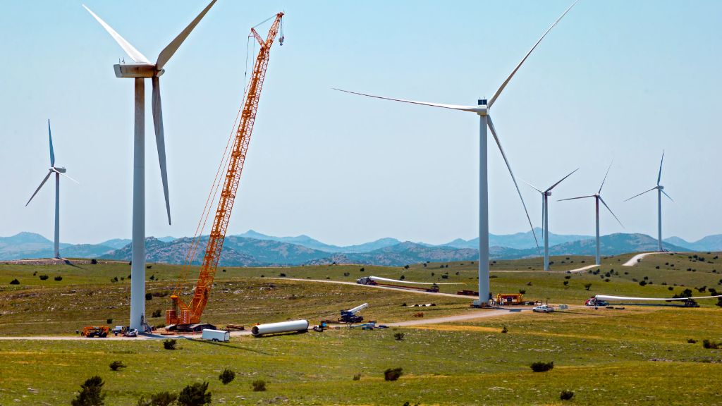 workers installing wind turbine as part of repowering project