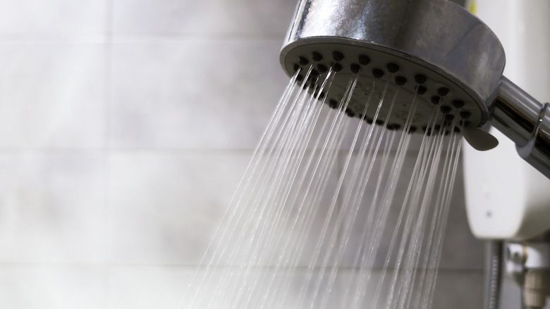 heating water on the stove or over a fire can enable a warm shower without electricity.