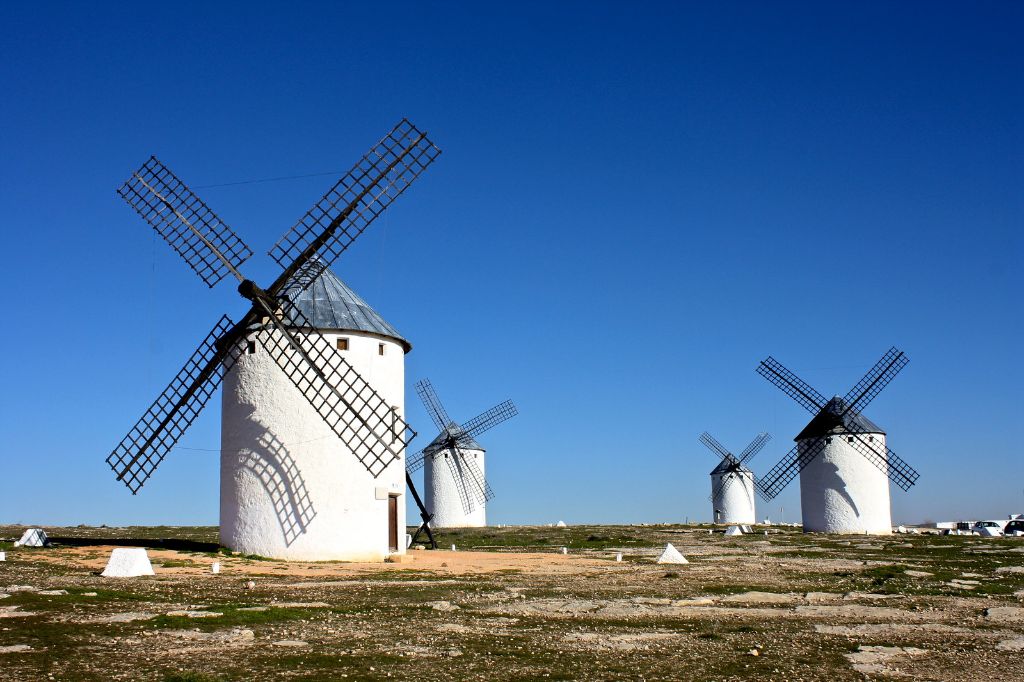 historic windmills dot the la mancha landscape in spain