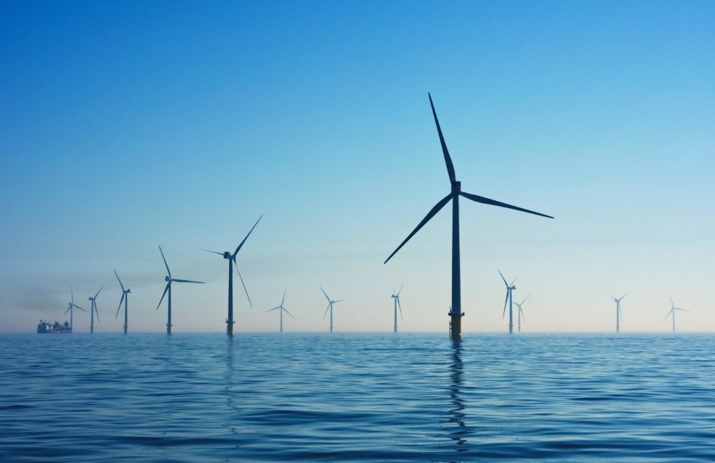 offshore wind turbines at sea generating renewable energy