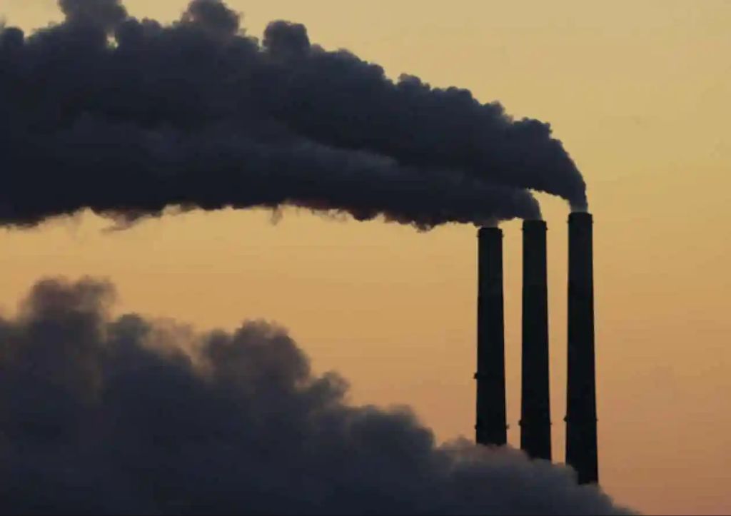 smokestacks emitting pollution into the sky