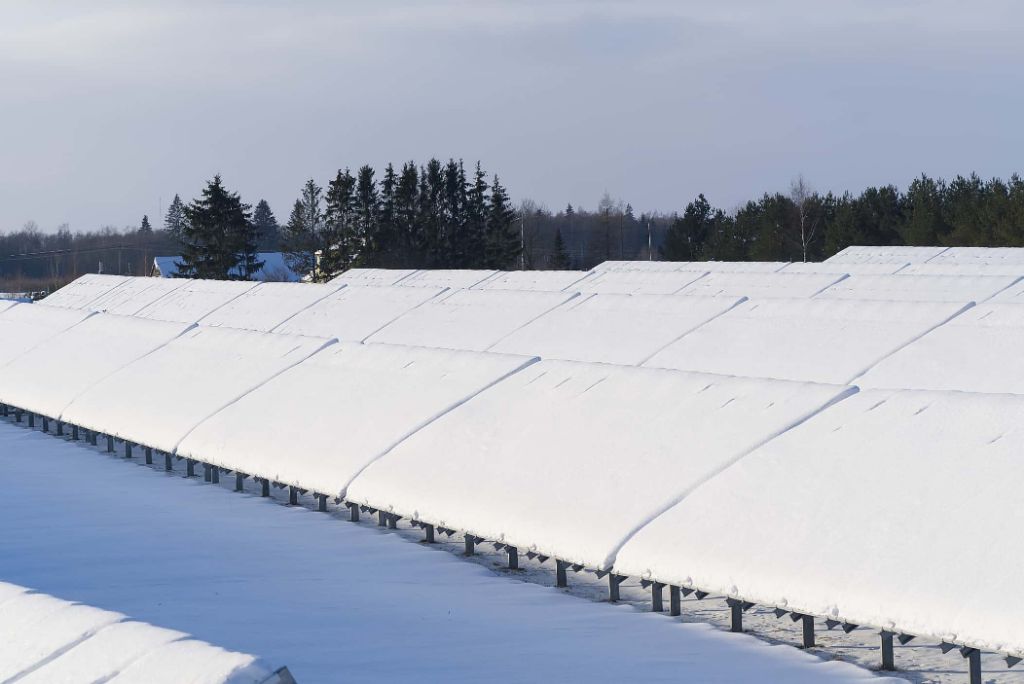 solar panels covered in snow