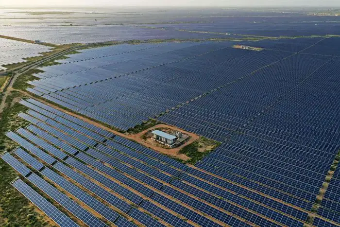 solar panels installed on empty land in rajasthan, india