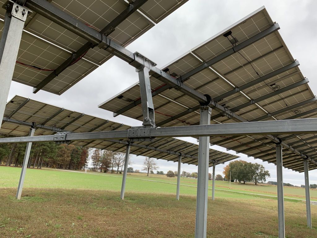 solar panels on racks at a solar farm