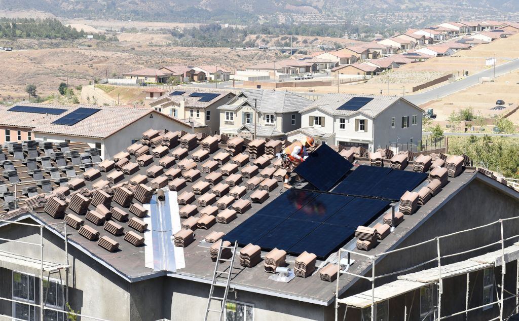 solar panels on rooftops can provide clean energy to homes in california.