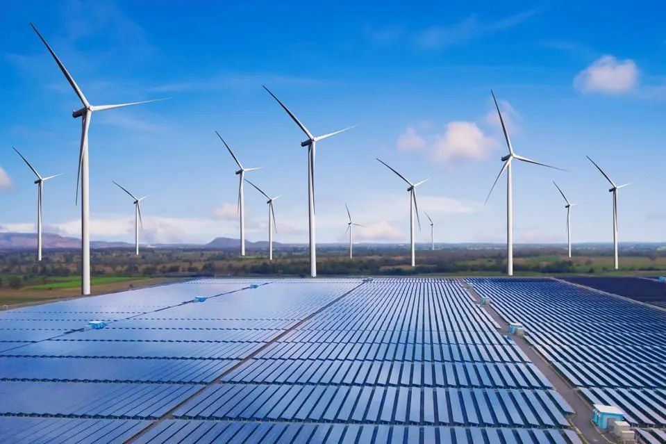 wind turbines and solar panels generating renewable electricity