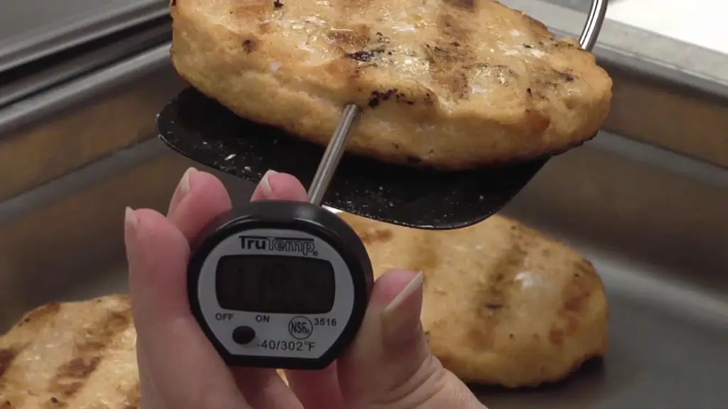 a thermometer measuring the temperature of food being cooked