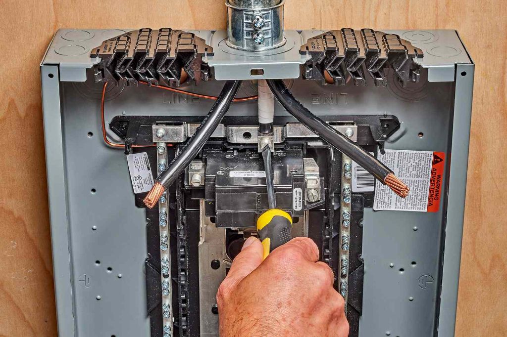 electrician wiring circuit breaker panel.