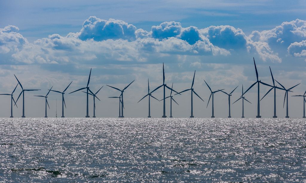 offshore wind turbines in the ocean generating renewable energy