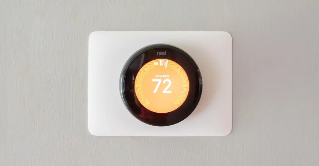smart thermostat adjusting school heating settings.