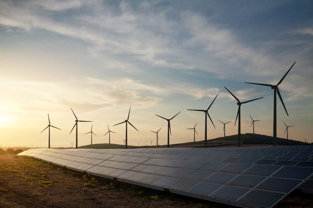 solar panels and wind turbines generating renewable energy