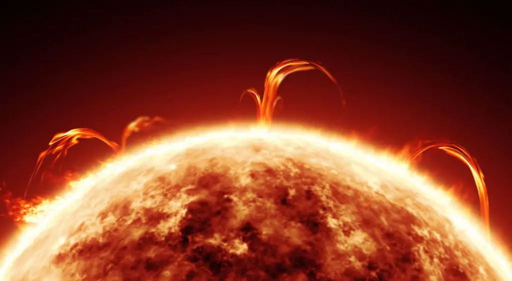 the sun glowing and emitting light and heat through nuclear fusion in its core.