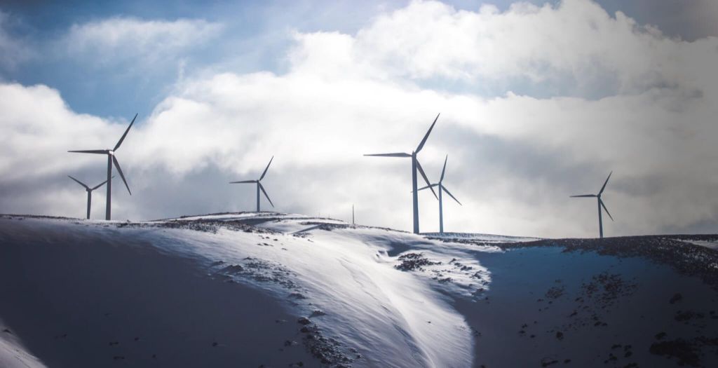 wind turbines spinning and generating electricity with no fuel costs